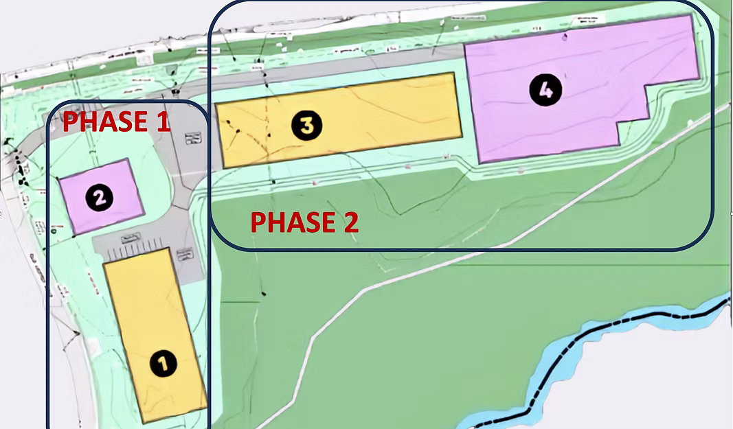 Site plan map of the Amston development with Phase 1 and Phase 2 areas, building pads, and surrounding land.