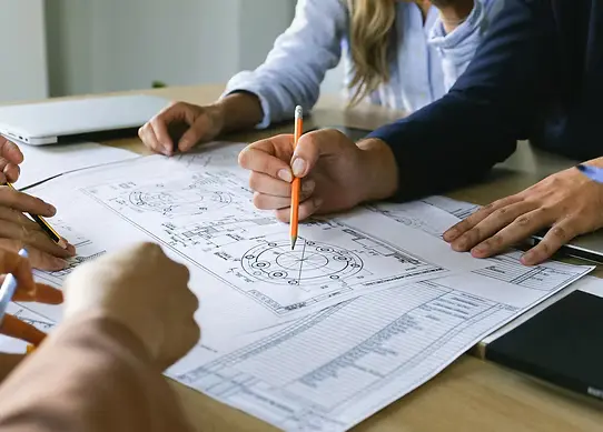 Planning documents and regulatory materials spread on a desk for review